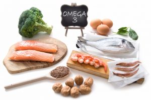 Collection of foods high in fatty acids omega 3 including seafood, vegetables and seeds