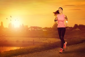 23961555 - young attractive woman jogging outdoor on sunset